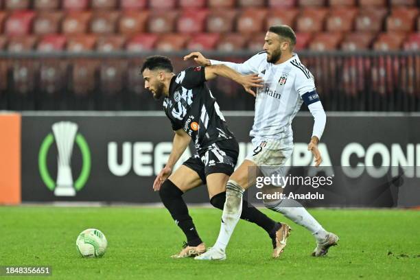 Cenk Tosun of Besiktas in action against Mahmoud Hadj of Lugano during UEFA Europa Conference League Group D week 6 football match between Lugano and...