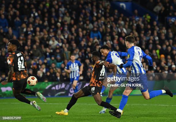 Brighton's Brazilian striker Joao Pedro shoots to score the opening goal of the UEFA Europa League Group B football match between Brighton and Hove...