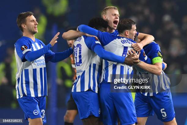 Brighton players celebrate on the final whistle in the UEFA Europa League Group B football match between Brighton and Hove Albion and Marseille at...