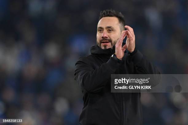 Brighton's Italian head coach Roberto De Zerbi applauds fans after the UEFA Europa League Group B football match between Brighton and Hove Albion and...