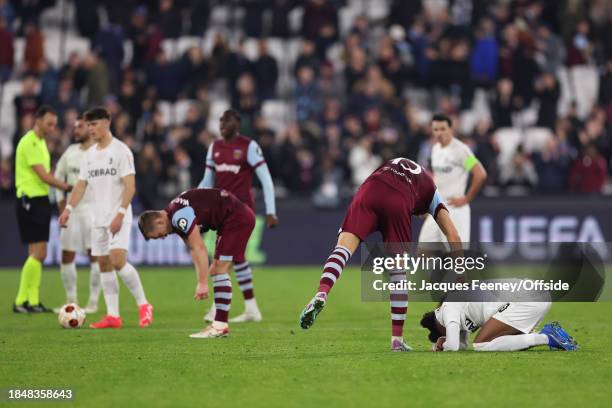 Konstantinos Mavropanos of West Ham comforts Junior Adamu of Freiburg during the UEFA Europa League match between West Ham United and Sport-Club...