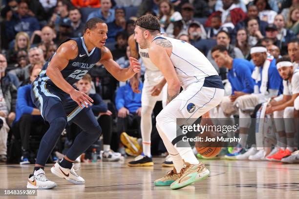 Luka Doncic of the Dallas Mavericks handles the ball during the game against Desmond Bane of the Memphis Grizzlies on December 11, 2023 at FedExForum...