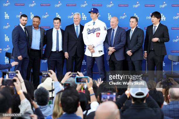 Dodgers general manager Brandon Gomes, from left, stands for a photo with manager Dave Roberts, president baseball operations Andrew Friedman, owner...