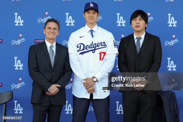 Agent Nez Balelo, Shohei Ohtani and Ippei Mizuhara pose for a photo during the Shohei Ohtani Los Angeles Dodgers Press Conference at Dodger Stadium...