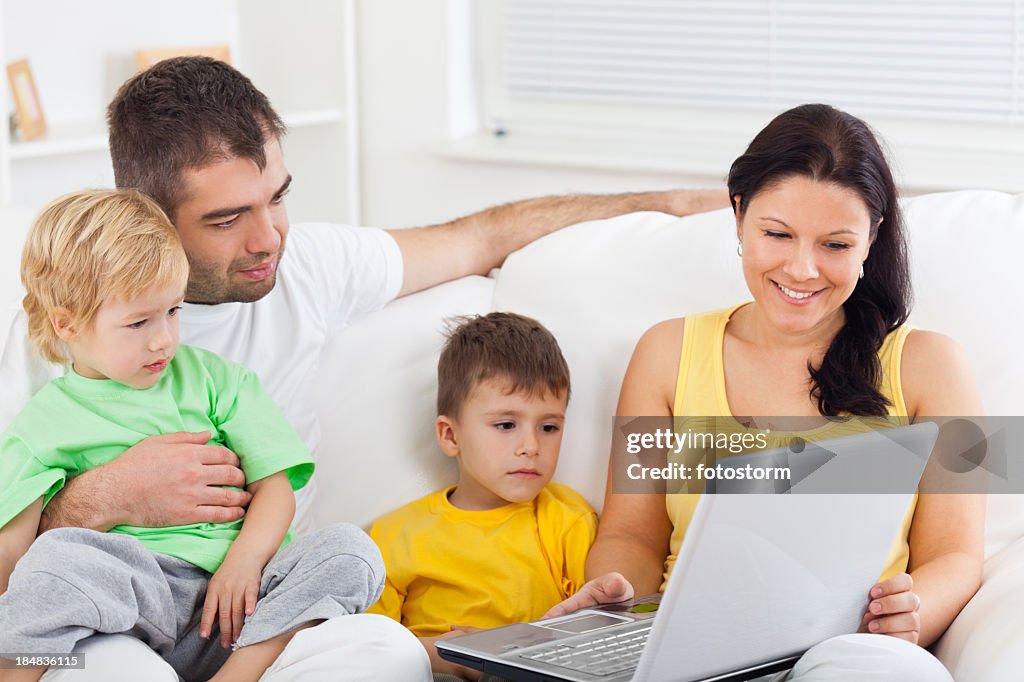 Happy family working on computer