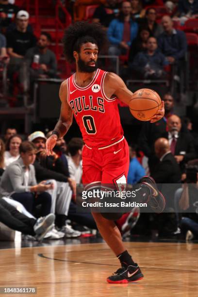Coby White of the Chicago Bulls drives to the basket during the game against the Miami Heat on December 14, 2023 at Miami-Dade Arena in Miami,...