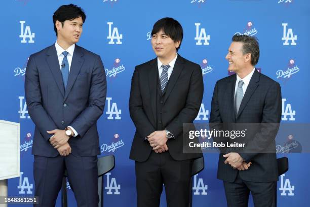 Shohei Ohtani and Ippei Mizuhara of the Los Angeles Dodgers and agent Nez Balelo look on during the Shohei Ohtani Los Angeles Dodgers Press...