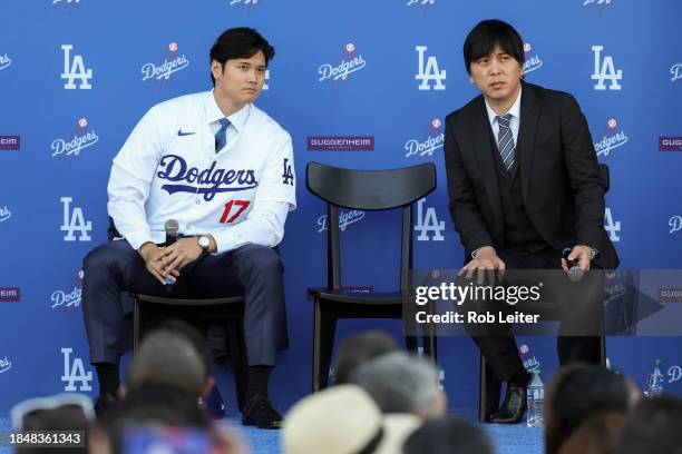 Shohei Ohtani answers questions and Ippei Mizuhara translates during the Shohei Ohtani Los Angeles Dodgers Press Conference at Dodger Stadium on...