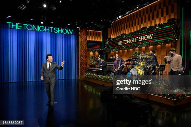 Episode 1891 -- Pictured: Host Jimmy Fallon and The Roots during the monologue on Thursday, December 14, 2023 --