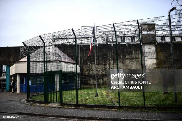 Man stands at the entrance gate to the Bordeaux-Gradignan jail in Gradignan on the outskirts of Bordeaux on December 11, 2023.