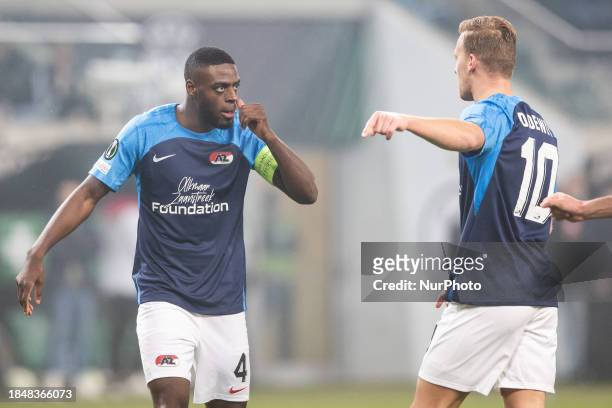 Bruno Martins Indi and Dani de Wit of AZ Alkmaar are playing in the UEFA Europa Conference League match against Legia Warsaw in Warsaw, Poland, on...