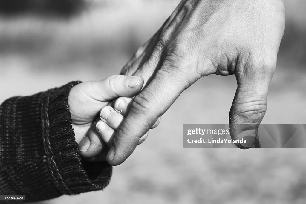 Father and Child Holding Hands