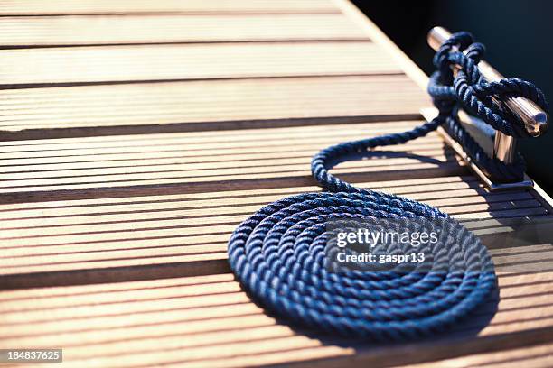 pier cleat and a mooring rope - bollard stock pictures, royalty-free photos & images