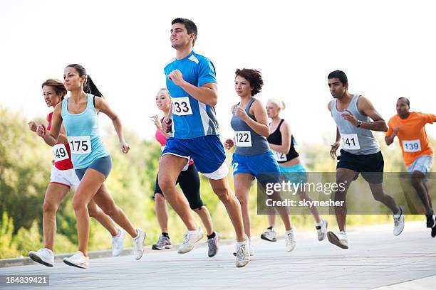 group of runners in a cross country race. - 10000 meter stockfoto's en -beelden