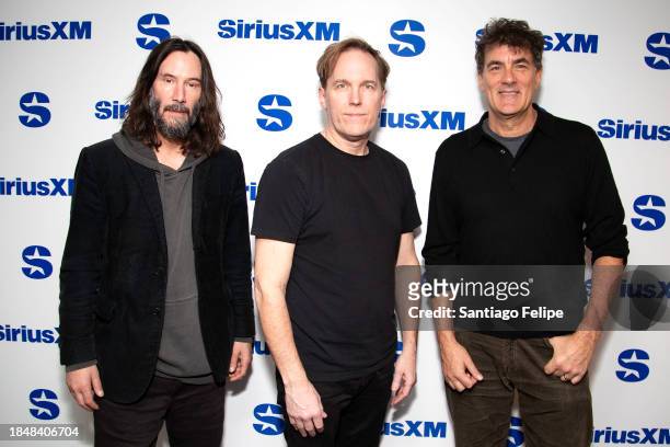 Keanu Reeves, Bret Domrose and Robert Mailhouse of Dogstar visit SiriusXM Studios on December 11, 2023 in New York City.