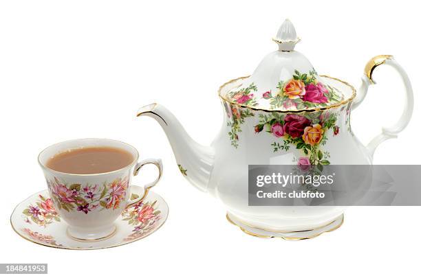 vintage bone china teapot with a cup of tea. - cup saucer stock pictures, royalty-free photos & images