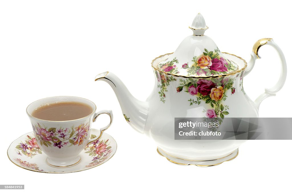 Vintage bone China teapot with a cup of tea.