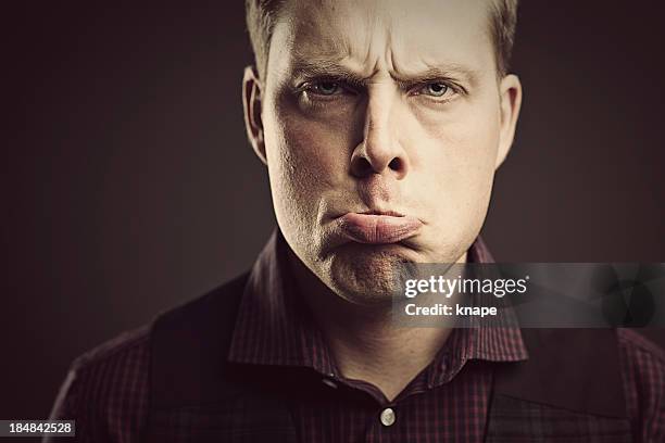 Grumpy Man High-Res Stock Photo - Getty Images