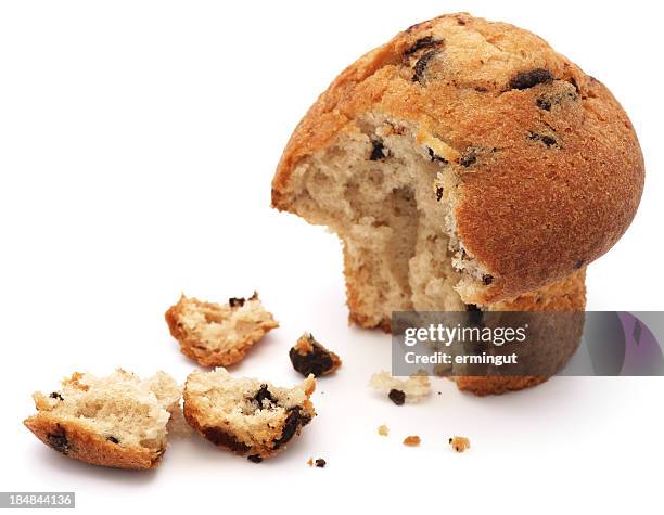 half eaten chocolate chip muffin isolated on white - muffin stockfoto's en -beelden