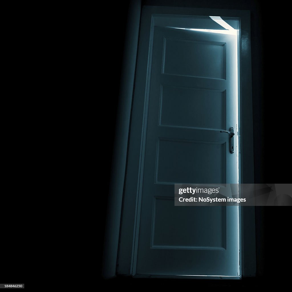 Dark door with glow behind