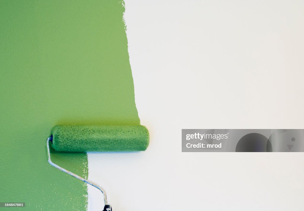 Paint Roller Painting a Wall