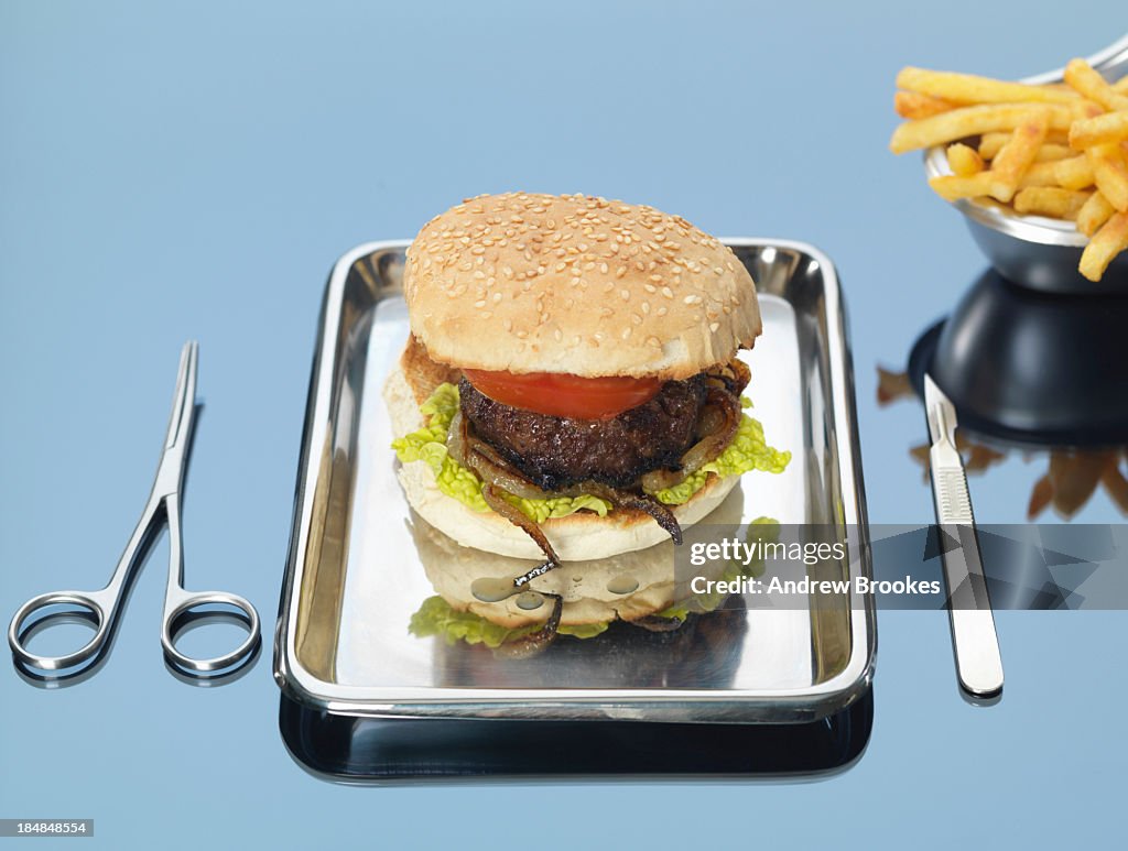 Still life of beef burger on surgical tray