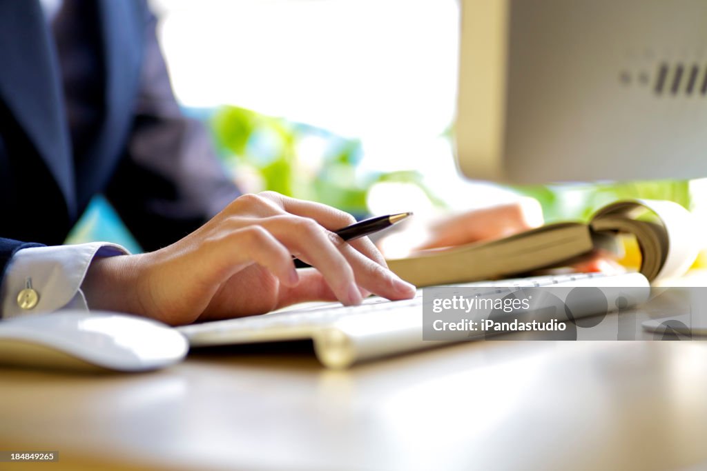 Close-up of working businesswoman