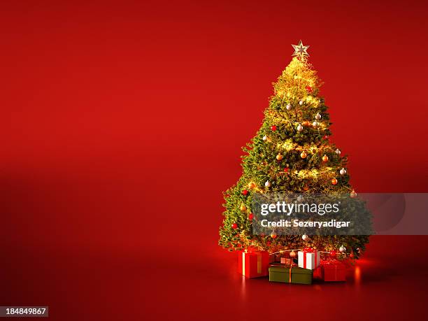 christmas tree on red background - christmas tree stock pictures, royalty-free photos & images