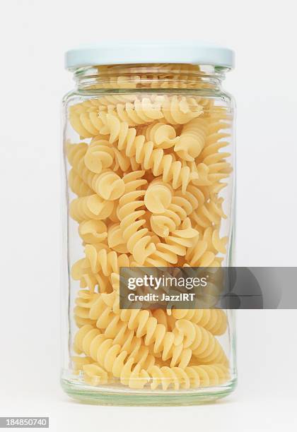 pasta in glass jar on a white background - canned food on white stock pictures, royalty-free photos & images