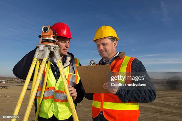 surveyor teamwork - geodesy stock pictures, royalty-free photos & images