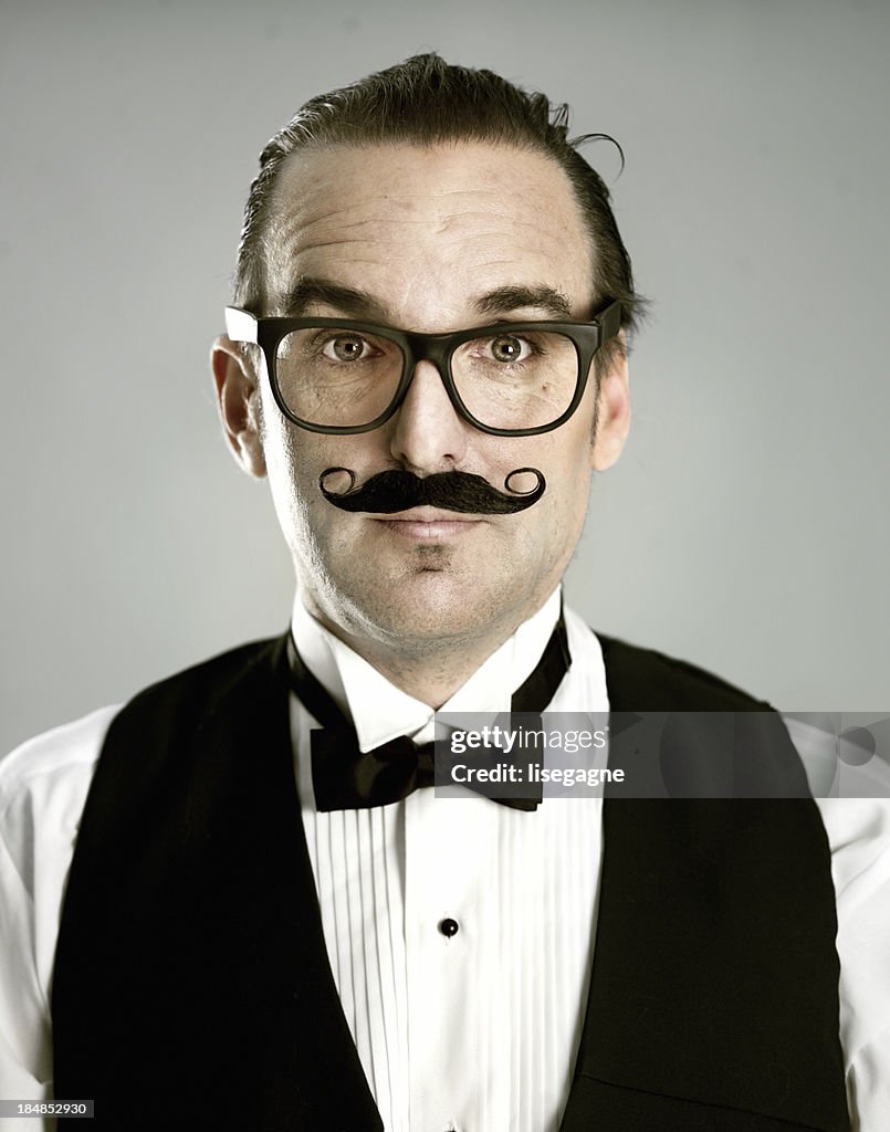 Man portrait wearing fake mustache