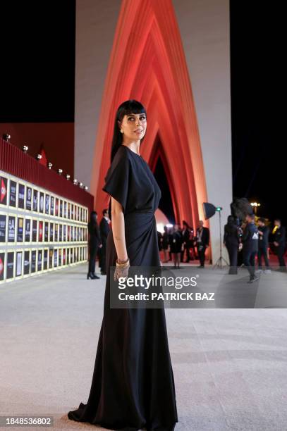 In this handout photo released by El Gouna Film Festival, Tunisian actress Fatima Nasser arrives during opening ceremony of the sixth edition of the...