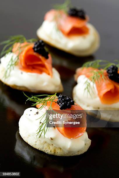 smoked salmon blinis - creme fraiche stock pictures, royalty-free photos & images