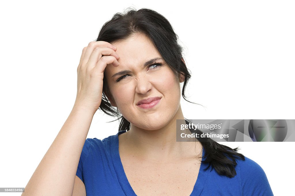 Confused Young Woman Scratches Head