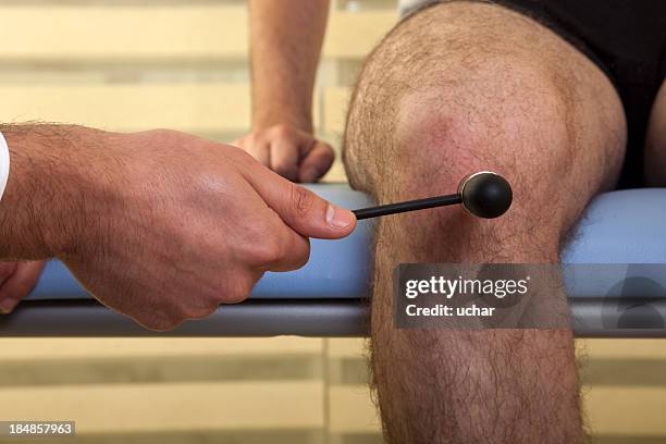 a neuropathologist checking a males reactions - physical senses stock pictures, royalty-free photos & images