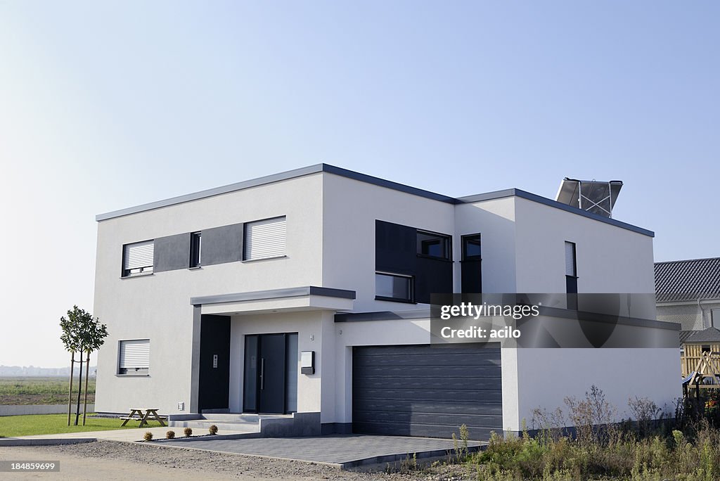 Modern luxury white house with garage