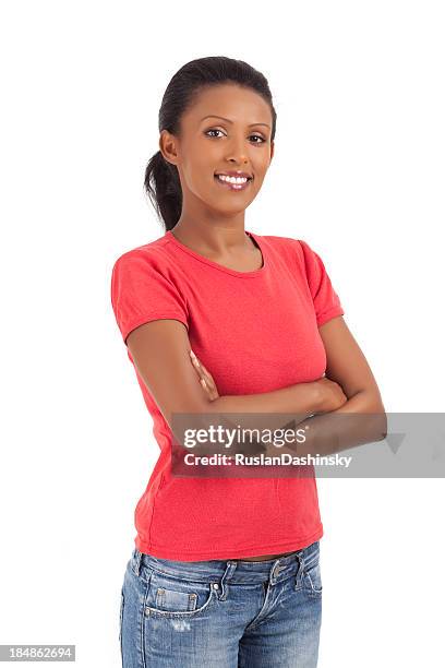 smiling lovely young woman standing with hands clasped. - ethiopian models women stock pictures, royalty-free photos & images