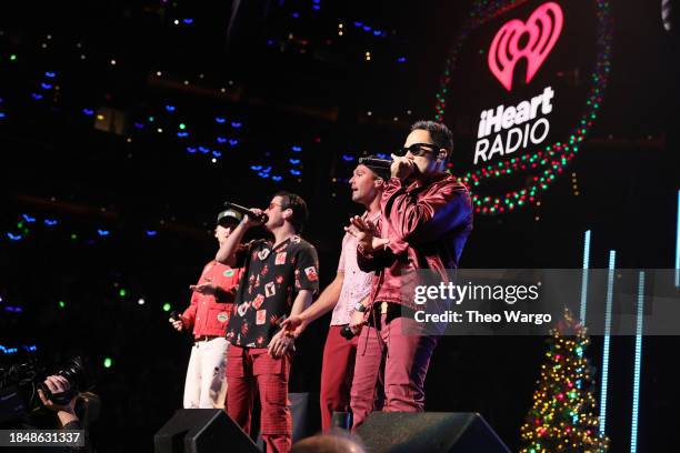 Kendall Schmidt, Logan Henderson, James Maslow, and Carlos PenaVega of Big Time Rush perform onstage during iHeartRadio Hot 99.5's Jingle Ball 2023...