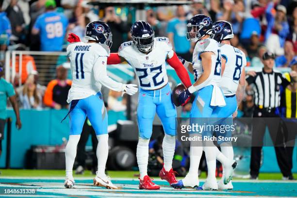 Derrick Henry of the Tennessee Titans celebrates with teammates after a rushing touchdown in the second quarter against the Miami Dolphins at Hard...