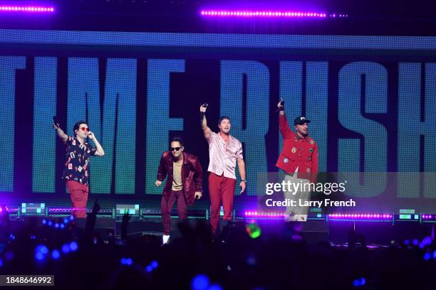 Logan Henderson, Carlos PenaVega, James Maslow, and Kendall Schmidt of Big Time Rush perform onstage during iHeartRadio Hot 99.5's Jingle Ball 2023...