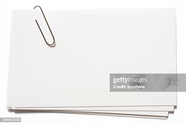 stacked blank white cards with paper clip on white background - paper clip stockfoto's en -beelden