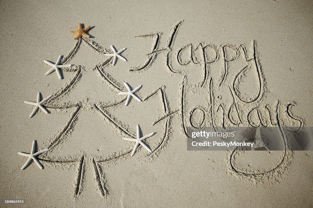 Joyeuses fêtes, arbre de Noël Message dans le sable