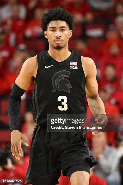 Jaden Akins of the Michigan State Spartans signals a three point basket against the Nebraska Cornhuskers in the second half at Pinnacle Bank Arena on...