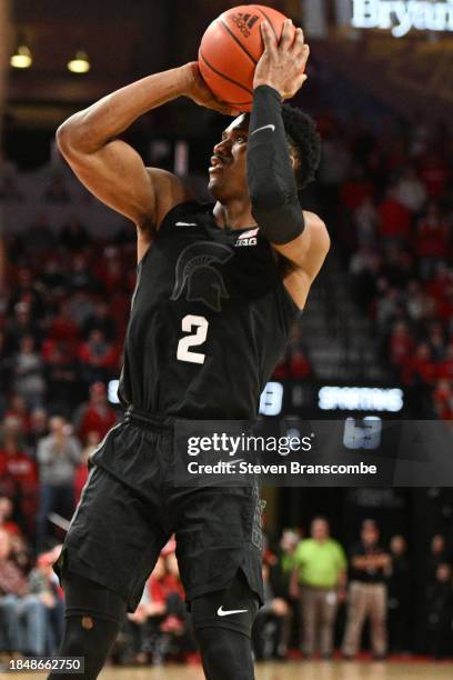 Tyson Walker of the Michigan State Spartans attempts a shot against the Nebraska Cornhuskers in the second half at Pinnacle Bank Arena on December...