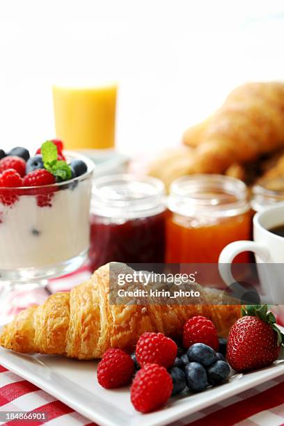 breakfast of fruit, juice, yogurt, croissant and coffee - continental breakfast stock pictures, royalty-free photos & images