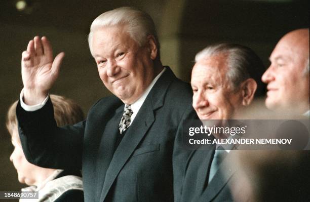 Russian President Boris Yeltsin waves his hand during the opening ceremony of the first International Youth Games at the Luzhniki Olympic Stadium, as...