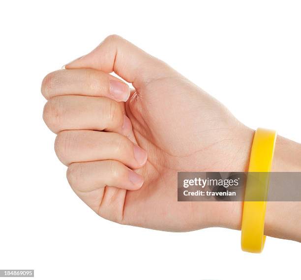 yellow wristband - bacelet stock pictures, royalty-free photos & images