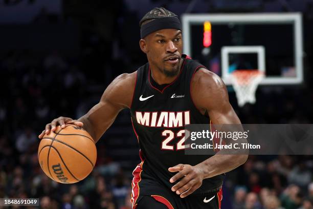 Jimmy Butler of the Miami Heat drives to the basket during the second half of their game against the Charlotte Hornets at Spectrum Center on December...