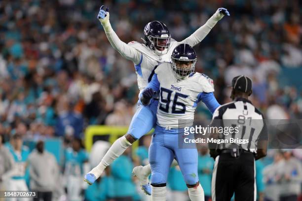 Chance Campbell and Denico Autry of the Tennessee Titans celebrate a field goal block in the first half against the Miami Dolphins at Hard Rock...