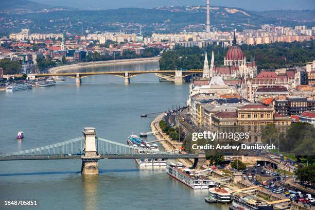 aerial view of budapest, hungary with the széchenyi chain bridge and hungarian parliament building. - chain bridge suspension bridge stock pictures, royalty-free photos & images